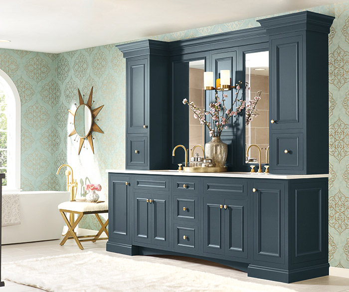 A classic-style bathroom with turquoise painted semi-custom cabinetry